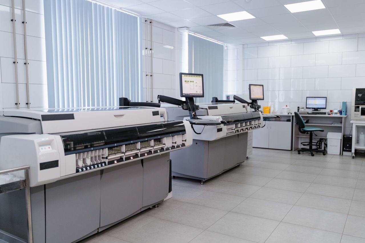 Technician servicing an office printer fleet